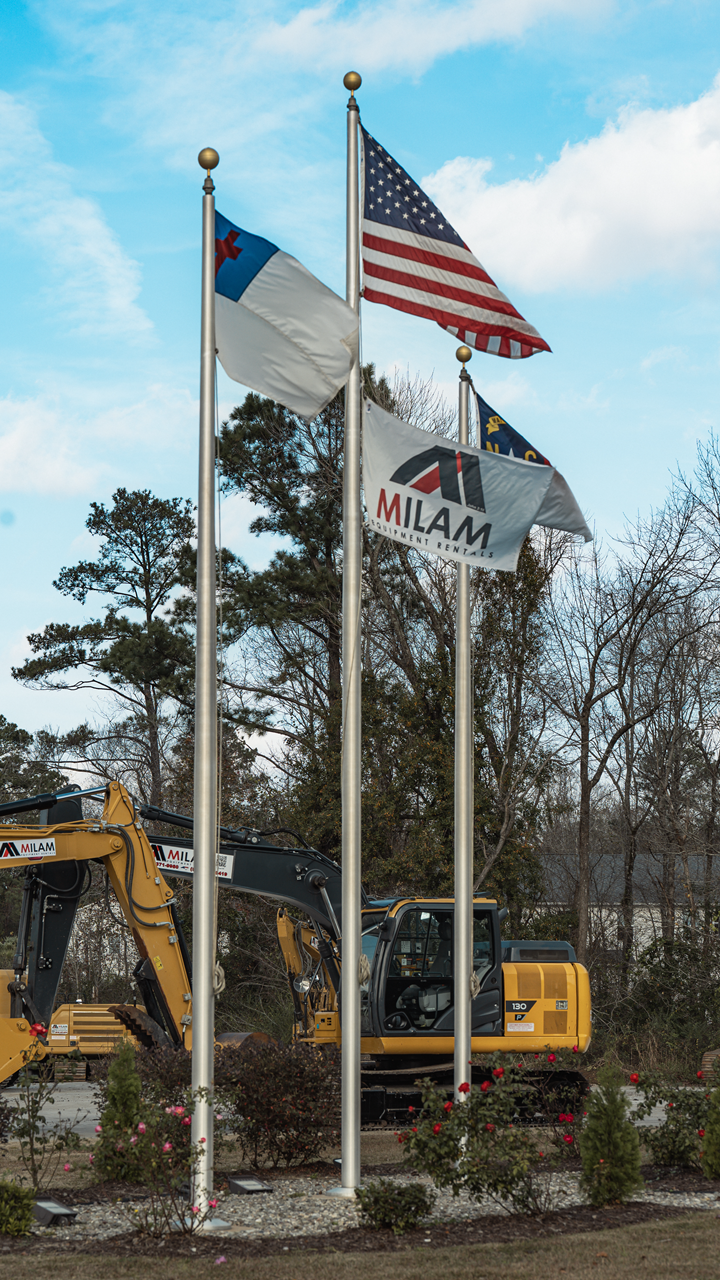 Milam Equipment Rentals flags and excavators