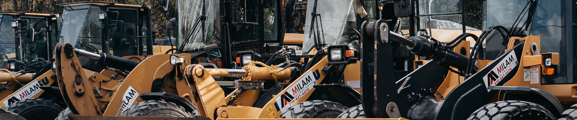 Milam Equipment Rentals yard with excavators and loaders