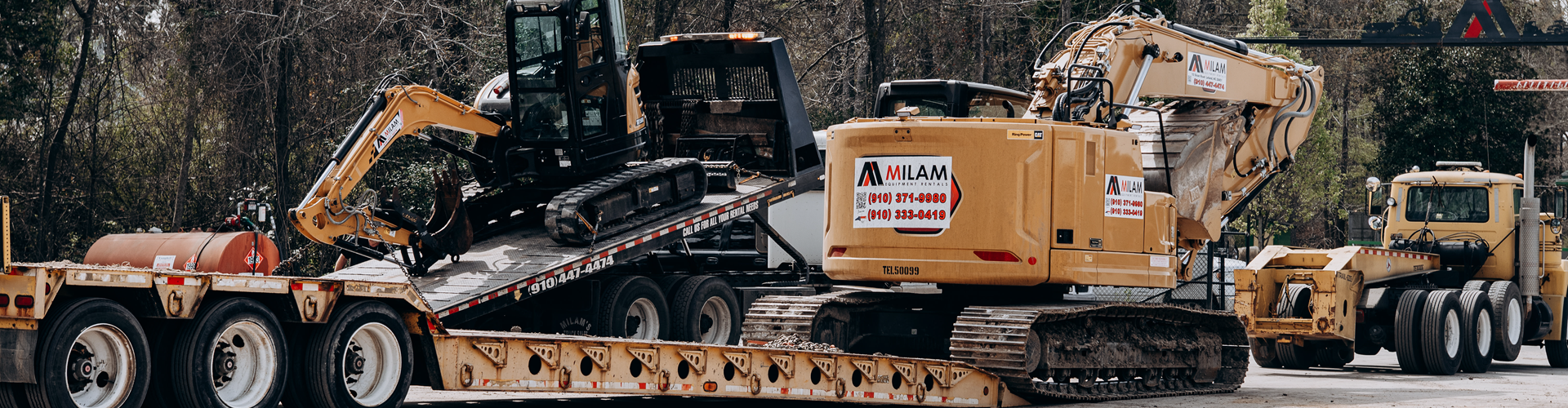 Milam Equipment Rentals service truck transporting heavy equipment